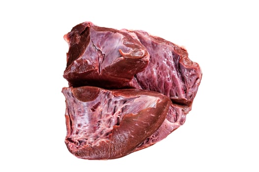 Cut Beef or veal raw heart on a butcher table. Isolated on white background photo
