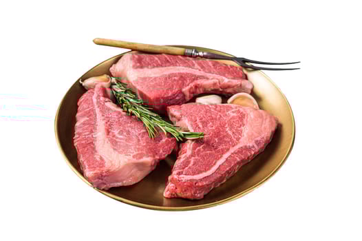 Raw Topside sirloin beef cut on steel plate with spices. Isolated on white background. Top view. photo