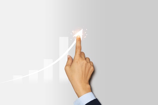 Businessman finger pointing arrow graph. Business development to success, profit and growing plan. photo