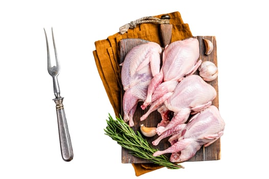 Plucked raw quails, fresh poultry on wooden board with spices. Isolated, white background. photo