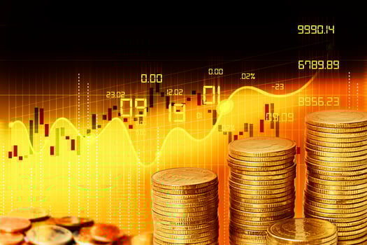 gold coins and stock market graph photo