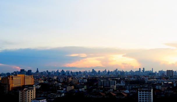 Cloudy sky and city background photo