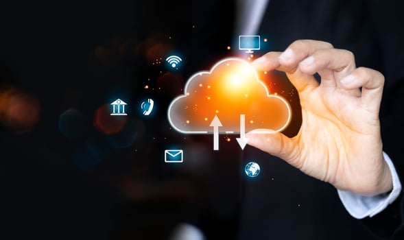 businessman holding a cloud computing icon on a black background photo