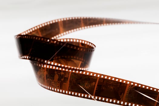 a film strip with a needle sticking out of it photo