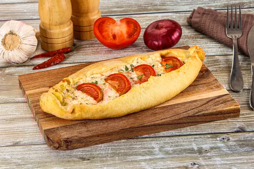 Turkish Pide with cheese and tomato photo