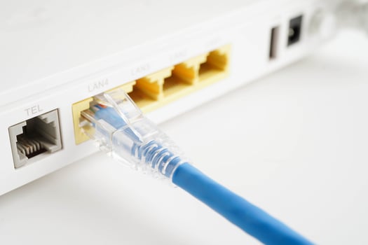 Ethernet cable with wireless router connect to internet service provider network. photo
