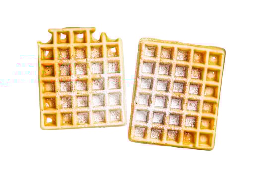 Viennese waffles with powdered sugar in kitchen steel tray. Isolated on white background. photo