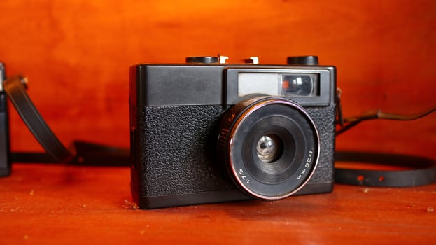Retro Old camera stack of vintage books photo