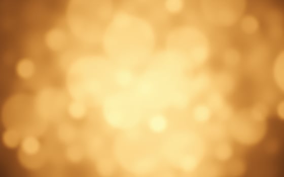 Glowing bokeh lights create a soft golden atmosphere in a blurred background during an evening gathering photo