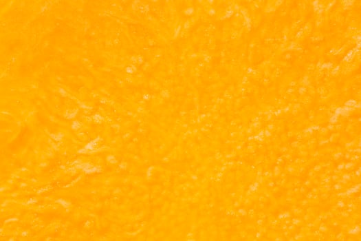 orange color backdrop, close up of pumpkin pulp texture photo