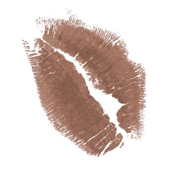 Kiss mark in a soft brown shade on a white background showcasing beauty and personal expression photo