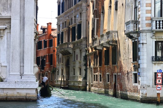 Gondola Ride through the enchanting canals of beautiful Venice, Italy photo