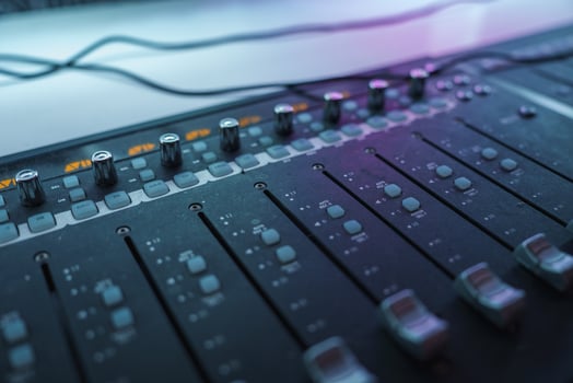 Close Up of Professional Audio Mixing Console in Studio Lighting photo
