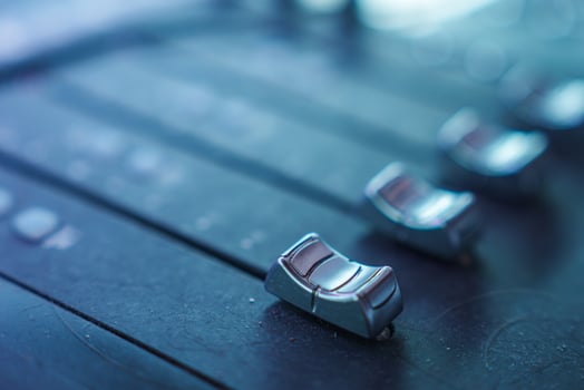 Close Up of Metallic Faders on Sound Mixing Console in Studio photo