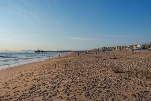 Manhattan Beach Pier Extending into Ocean with Beachfront Homes photo