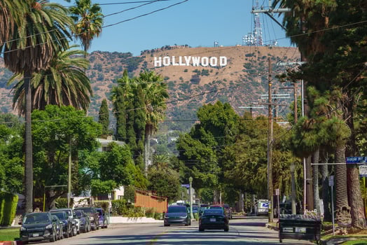 Iconic Hollywood Sign with Palm Lined Street in Los Angeles photo