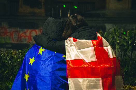 Tbilisi, Georgia - 1st december, 2024 - two girls hug united stand for Georgia and EU integration. Protesters georgians by parliament protest and stand for EU. European Union manifestation photo