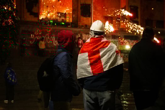 Tbilisi, Georgia - 1st december, 2024 - Protesters georgians by parliament protest and stand for EU. European Union manifestation. Protests against Government.Security spray water on demonstrators photo
