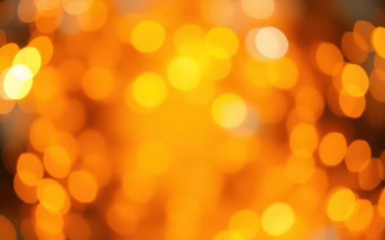 Warm golden bokeh lights create a magical atmosphere for festive celebrations in an evening setting photo