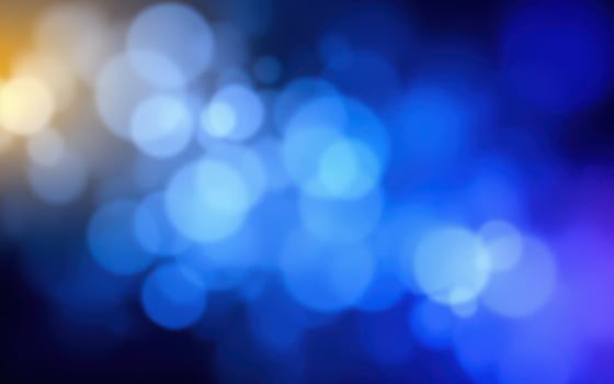 Colorful abstract bokeh background creates a vibrant visual experience with blue hues and warm accents photo