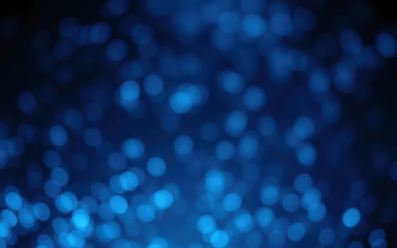 Vibrant blue bokeh lights create a dreamy atmosphere in a nighttime setting photo