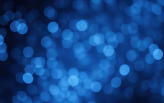 Vivid blue bokeh lights create a mesmerizing background for artistic projects and digital designs photo