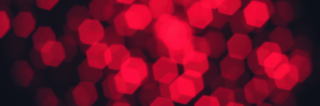 Vivid red bokeh lights create a festive atmosphere during a nighttime celebration event at a local venue photo