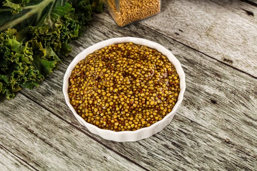 Mustard sauce with seeds in the bowl photo