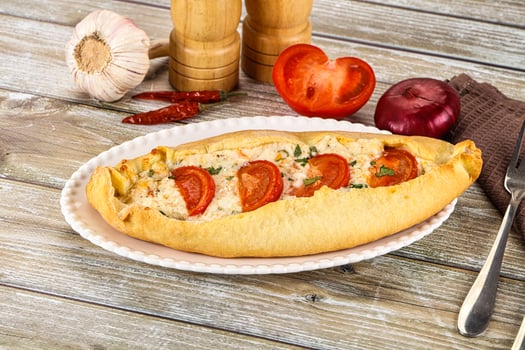 Turkish Pide with cheese and tomato photo