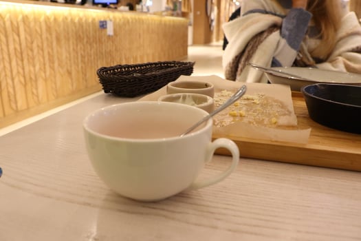 Warm Tea and Cozy Atmosphere in a Modern Caf Setting photo