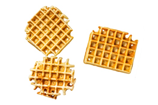 Cooking of fresh waffles in waffle maker. Isolated on white background. photo