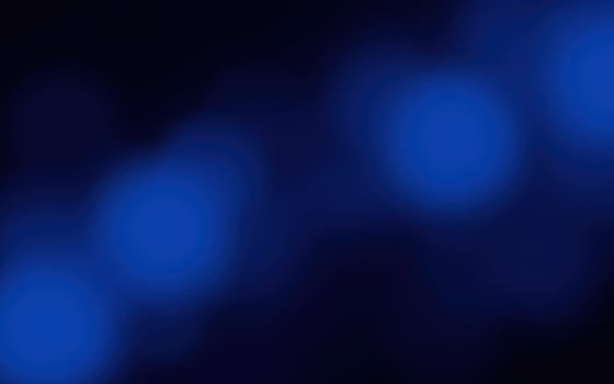 Soft blue glowing lights create a tranquil atmosphere in a dark setting for relaxation or meditation photo