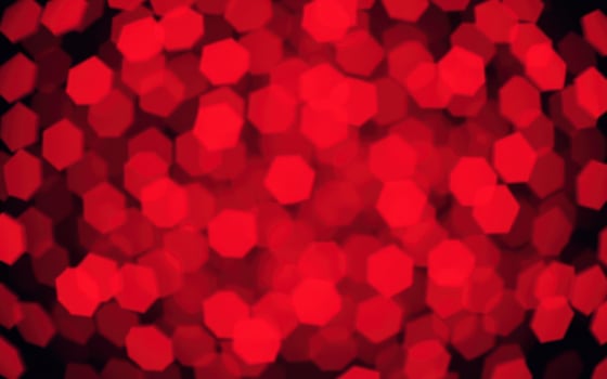 Vivid red hexagonal patterns creating a vibrant and dynamic backdrop for celebrations and events photo