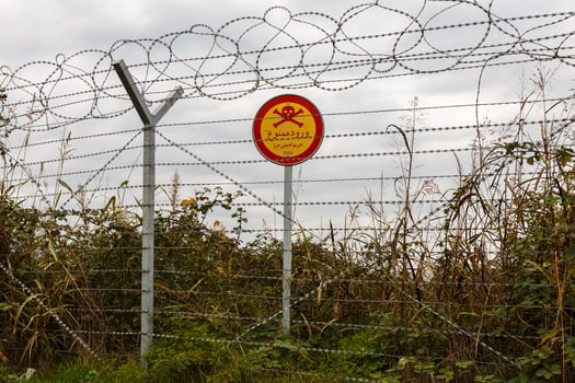 border of Iran and Azerbaijan, barbed wire and sign photo