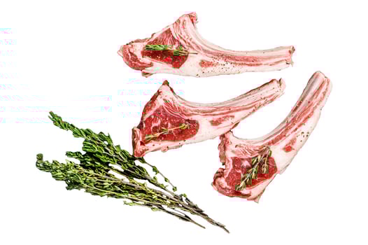 Raw fresh lamb ribs with pepper and rosemary. Organic meat. Isolated on white background. Top view. photo