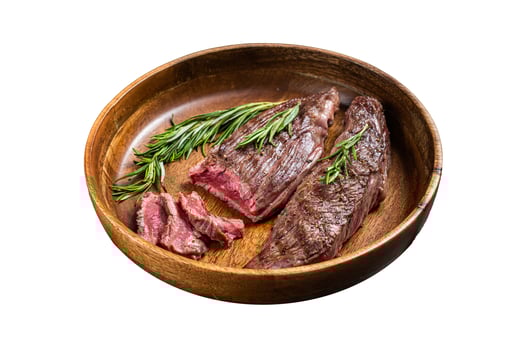 Fried sirloin flap or flank beef steak with herbs in a wooden plate. Isolated on white background. photo