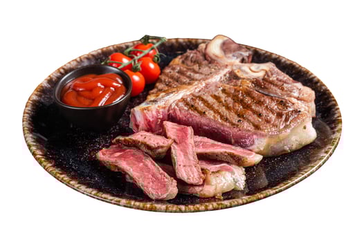 Grilled porterhouse beef meat Steak, cooked t bone in a plate with tomato. Isolated on white background. photo