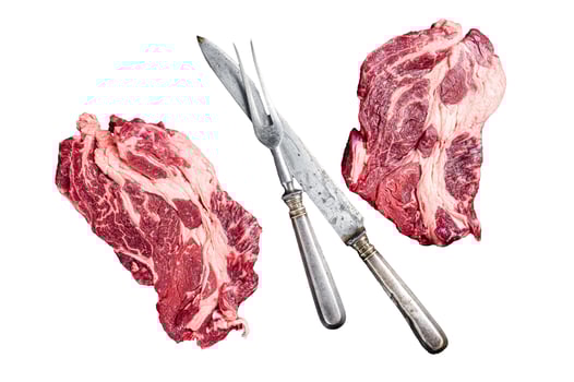Fresh marbled meat Steaks with meat knife and fork table, beef rib eye steak. Isolated, white background. photo