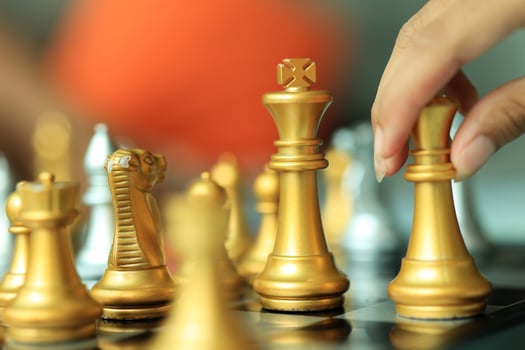 Professional Chess Player Moving a Piece photo