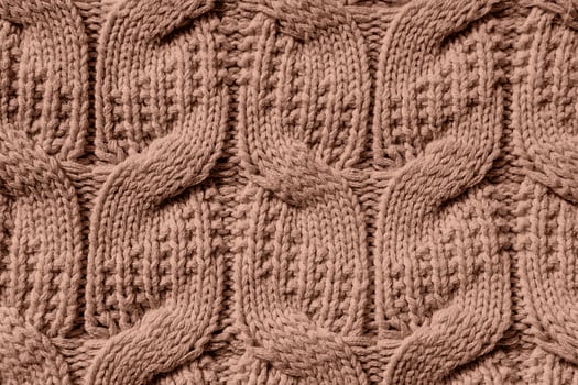 Beautiful handmade knitted repeating pattern. Demonstrating the colors of 2025 - Mocha Mousse photo