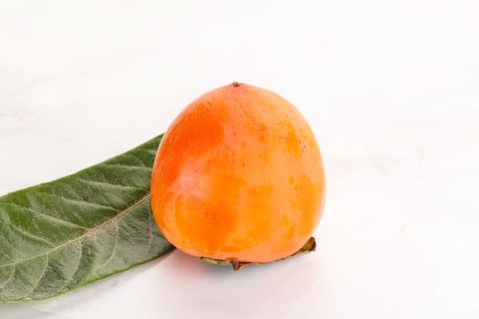 Fresh ripe sweet juicy persimmon photo