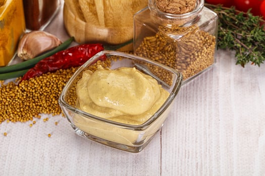 Dijon mustard sauce in the bowl photo