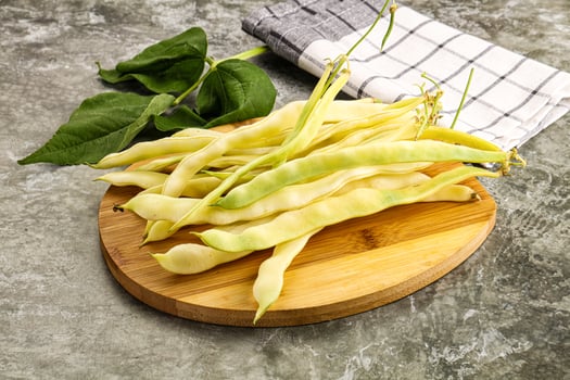 Raw green bean strings heap photo