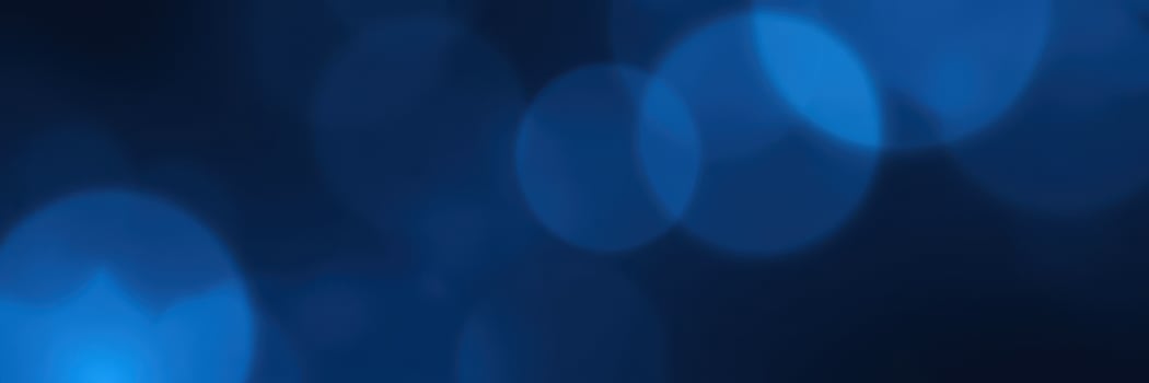 Soft blue bokeh lights create a calming atmosphere at night during a social gathering photo