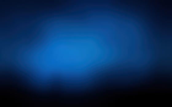 Vibrant blue light creates an abstract atmosphere against a dark background photo