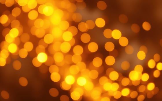 Warm golden bokeh lights create a cozy and festive atmosphere during an evening celebration in a softly lit space photo