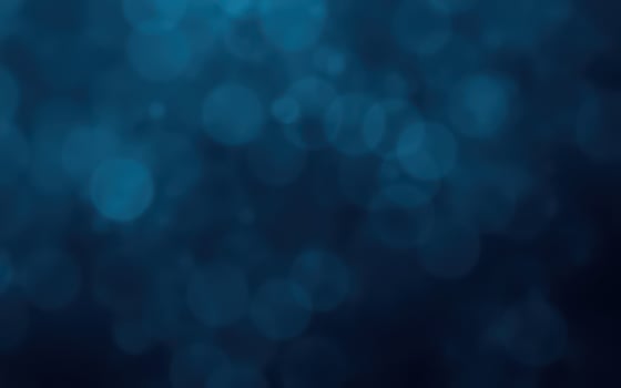 Abstract blue bokeh background creates a serene and calming effect suitable for various design projects photo