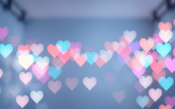 Colorful heart-shaped bokeh lights adorn a festive space for celebrations and romantic occasions photo