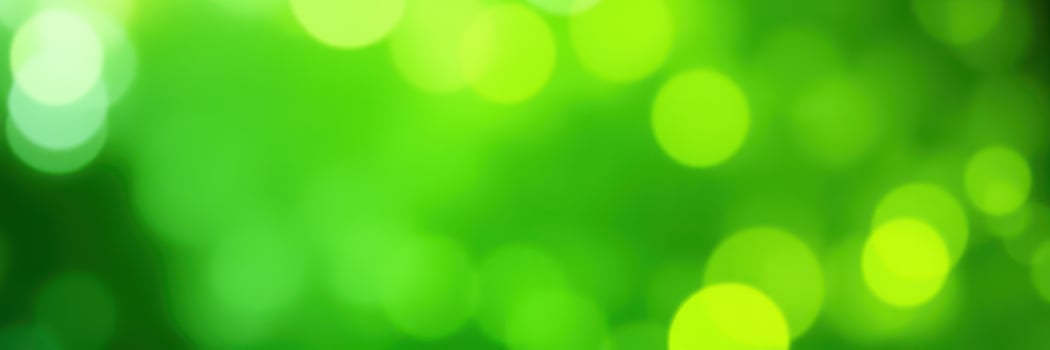 Abstract green bokeh background creating a vibrant atmosphere of nature and light during a sunny day photo