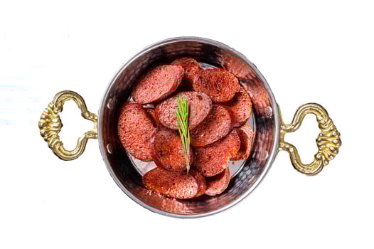 Turkish fried sausage sucuk in a pan. Isolated on white background, top view. photo
